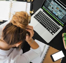 woman sitting in front of macbook