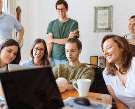 people looking at laptop computer