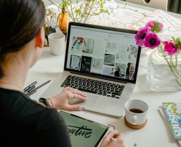 photo of person using laptop for graphic designs