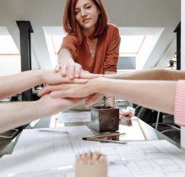 a group of people with their hands together