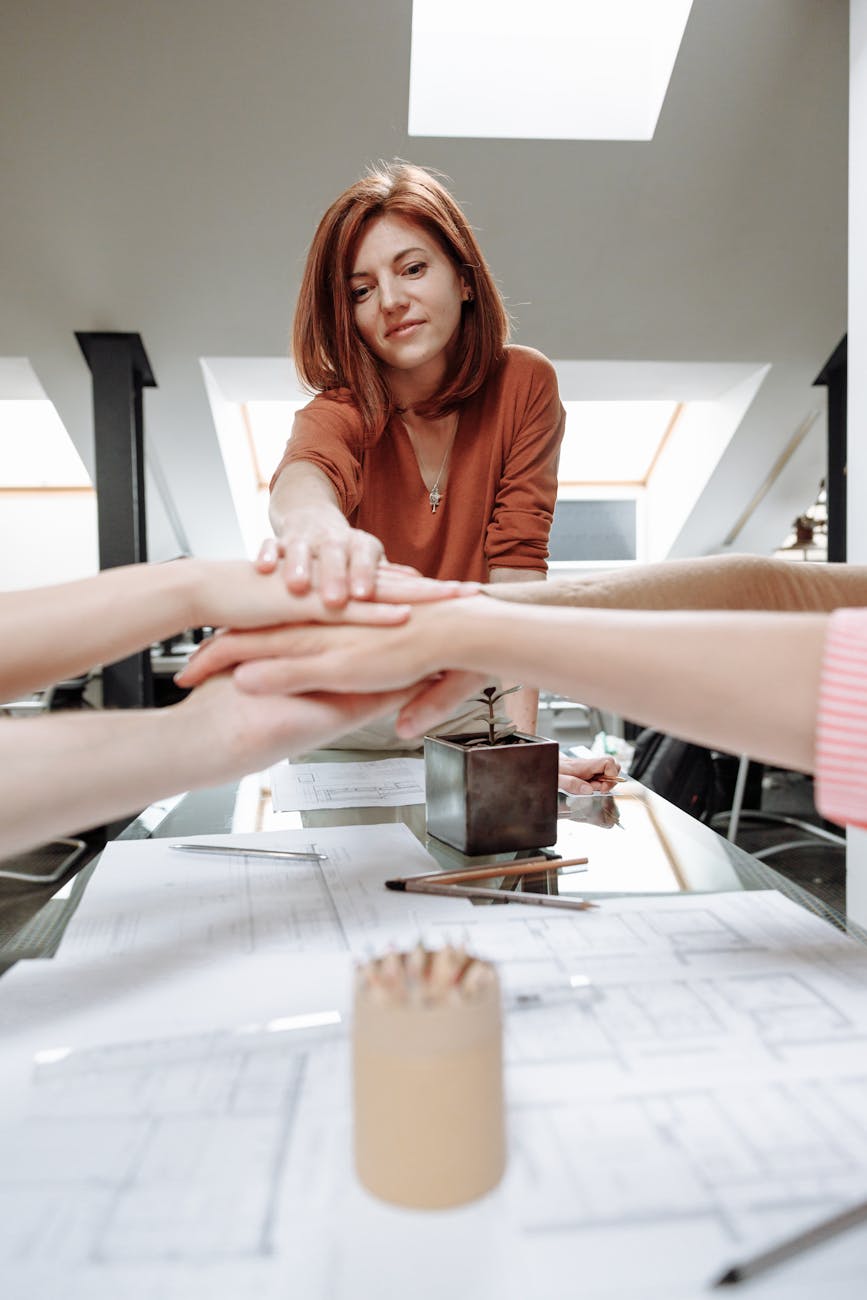 a group of people with their hands together