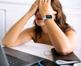a woman covering her face