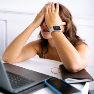 a woman covering her face