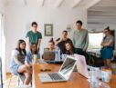 group of people watching on laptop