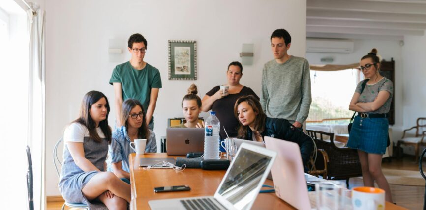 group of people watching on laptop