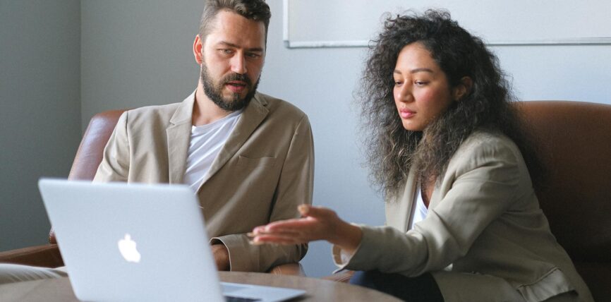 focused man working with female colleague in office