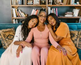 women leaning on the person in pink long sleeves