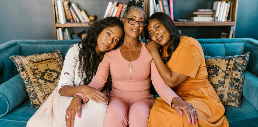 women leaning on the person in pink long sleeves
