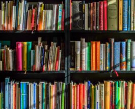 books in black wooden book shelf