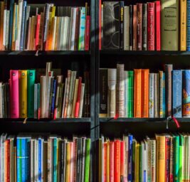 books in black wooden book shelf