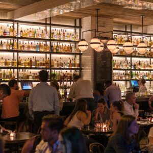 group of people gathering inside bar