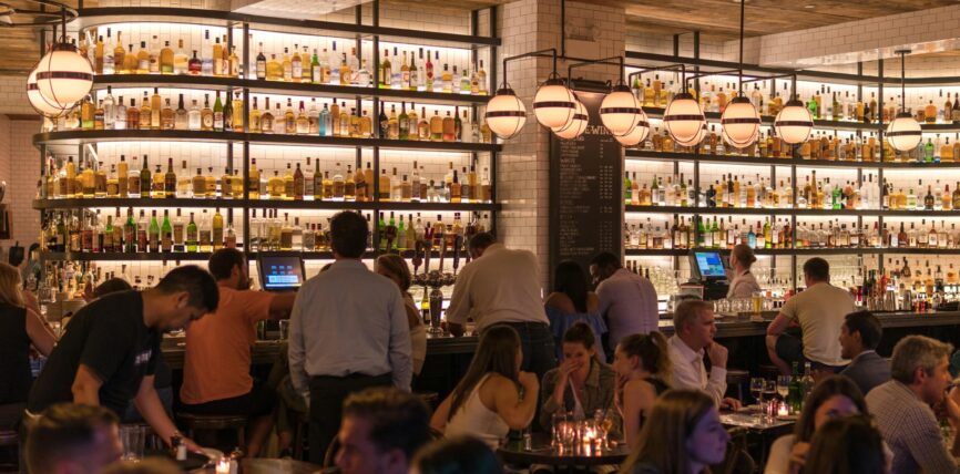 group of people gathering inside bar