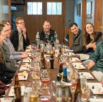 group of people sitting on dining table