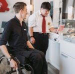 men using tablet computer on the kitchen counter top