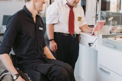 men using tablet computer on the kitchen counter top