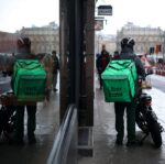 uber eats courier reflected in street mirror edinburgh