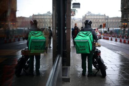 uber eats courier reflected in street mirror edinburgh