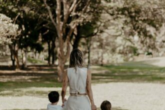 mother and children walking in a park