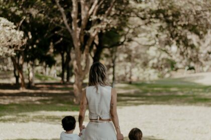 mother and children walking in a park