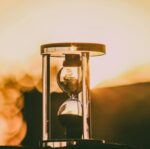 selective focus photography of hour glass